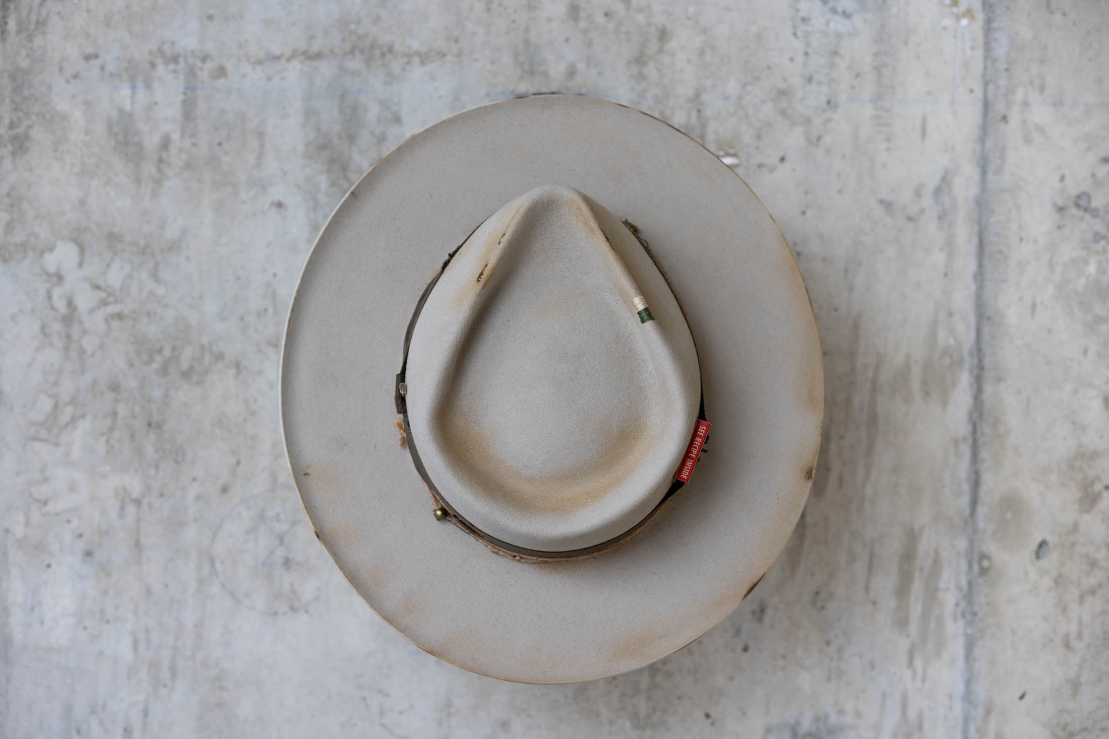 Silverbelly distressed beaver felt hat with teardrop crown and green band top
