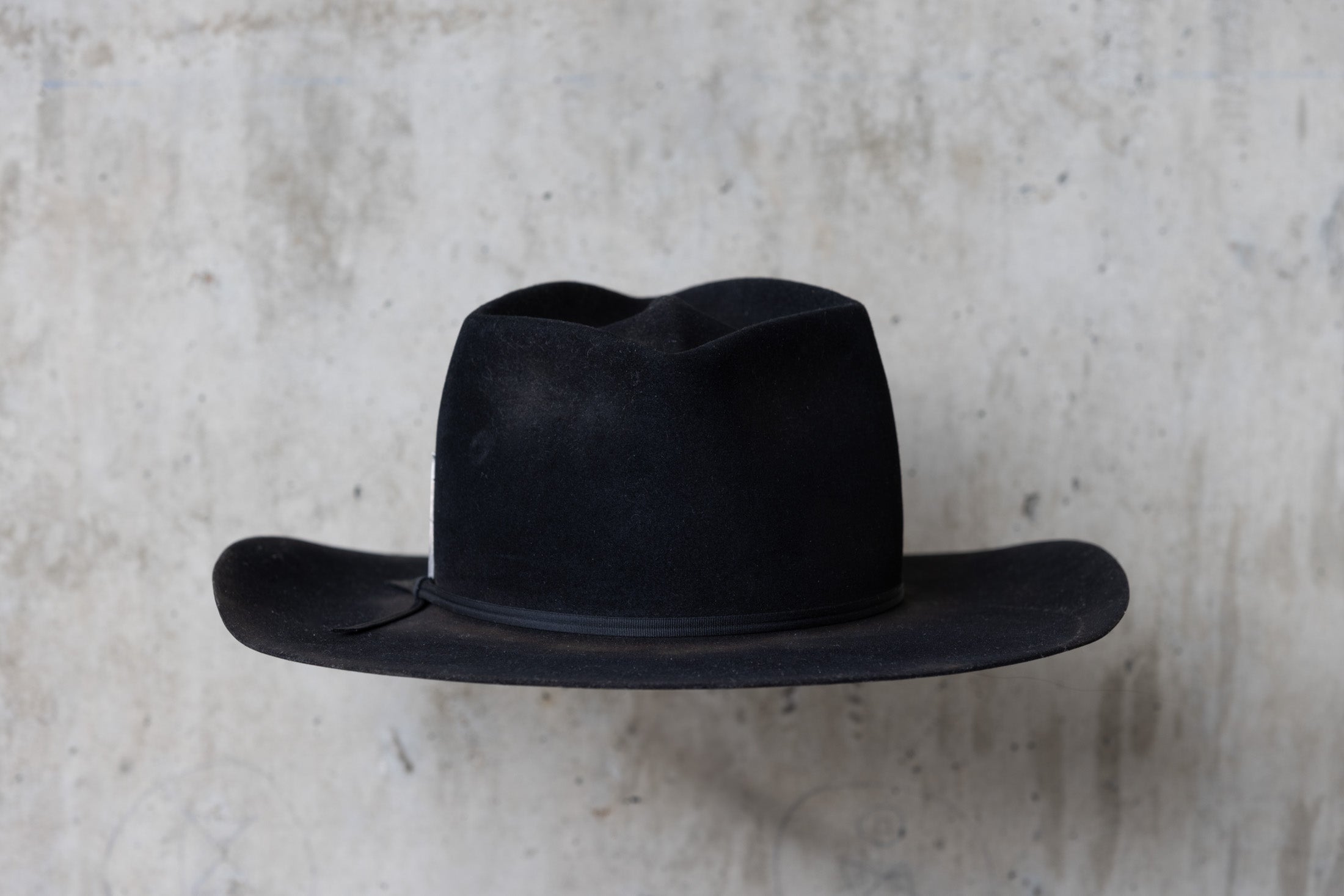 A black beaver felt western style hat back side