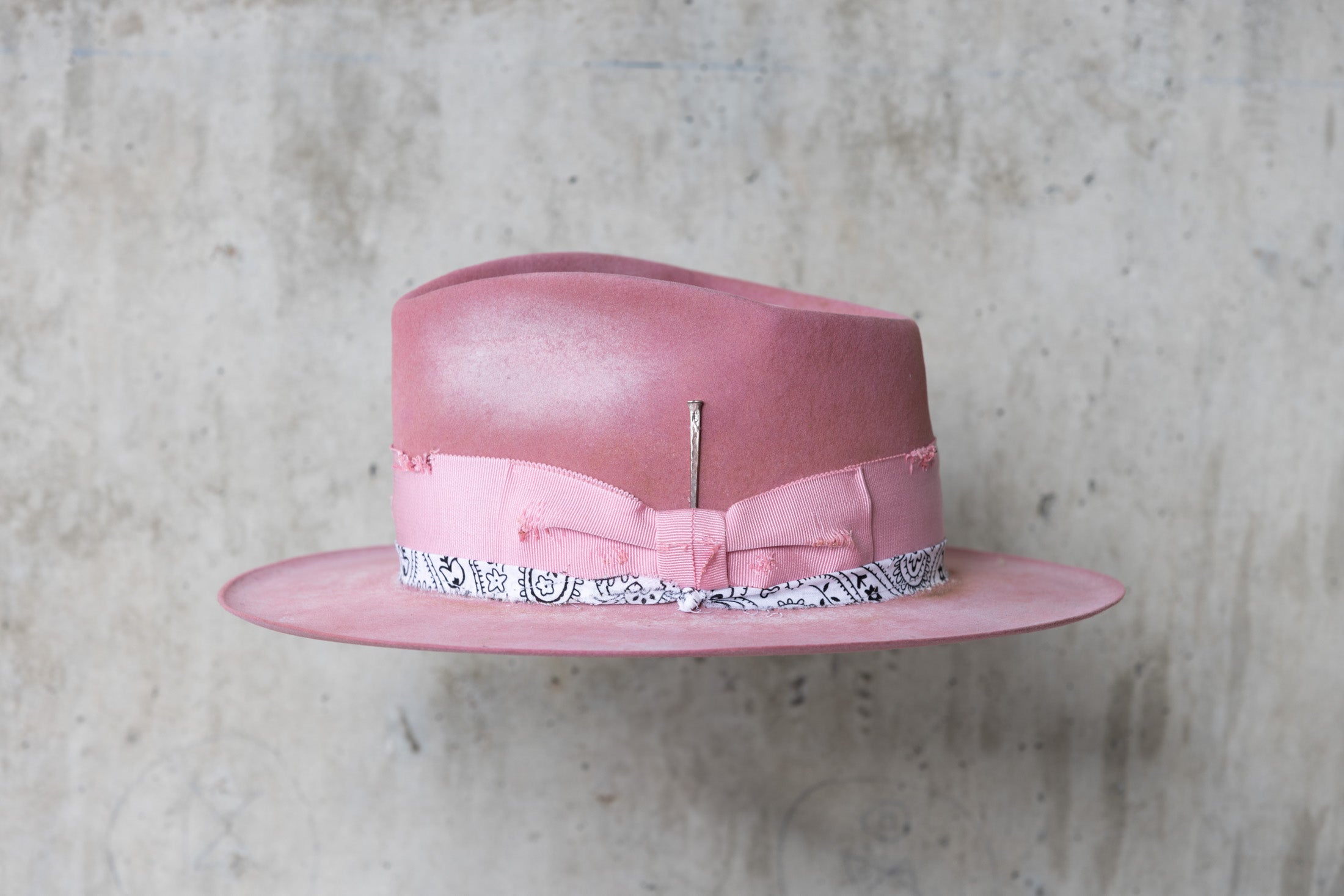 pink rabbit beaver felt distressed hat with a fedora teardrop crown and flat brim for men and women left