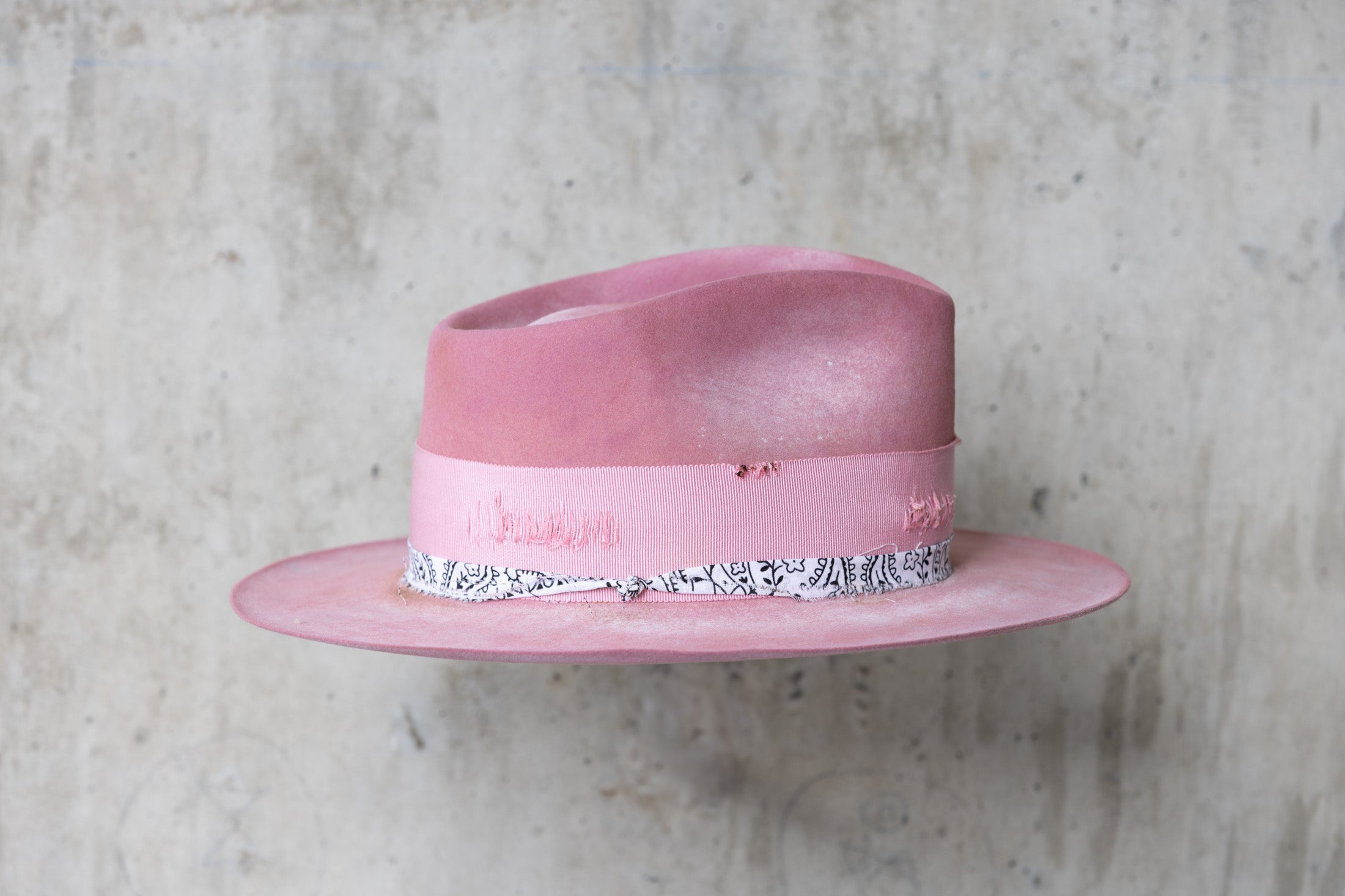 pink rabbit beaver felt distressed hat with a fedora teardrop crown and flat brim for men and women right
