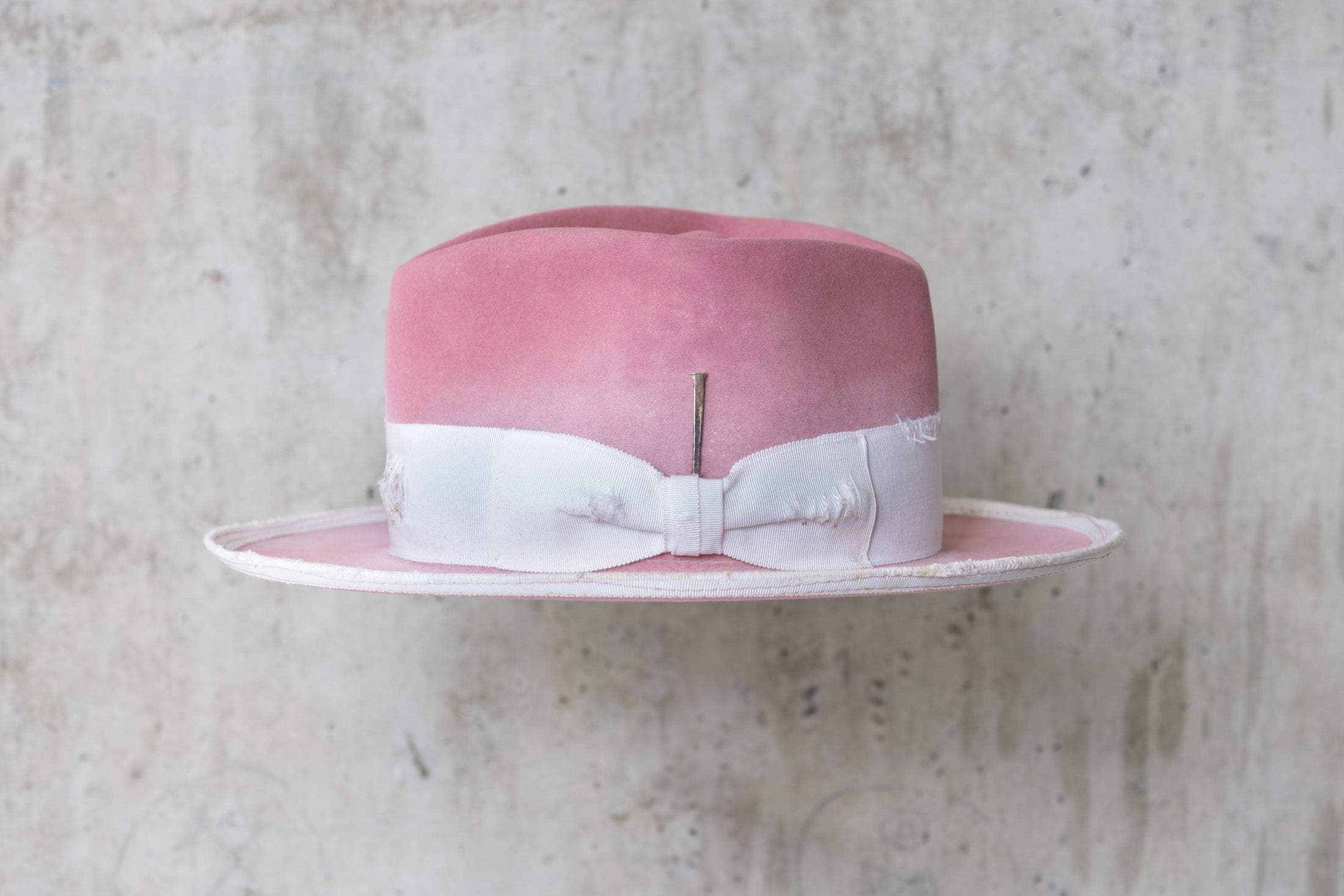 dusty pink rabbit beaver felt distressed hat with a fedora diamond crown and curled brim for men and women left