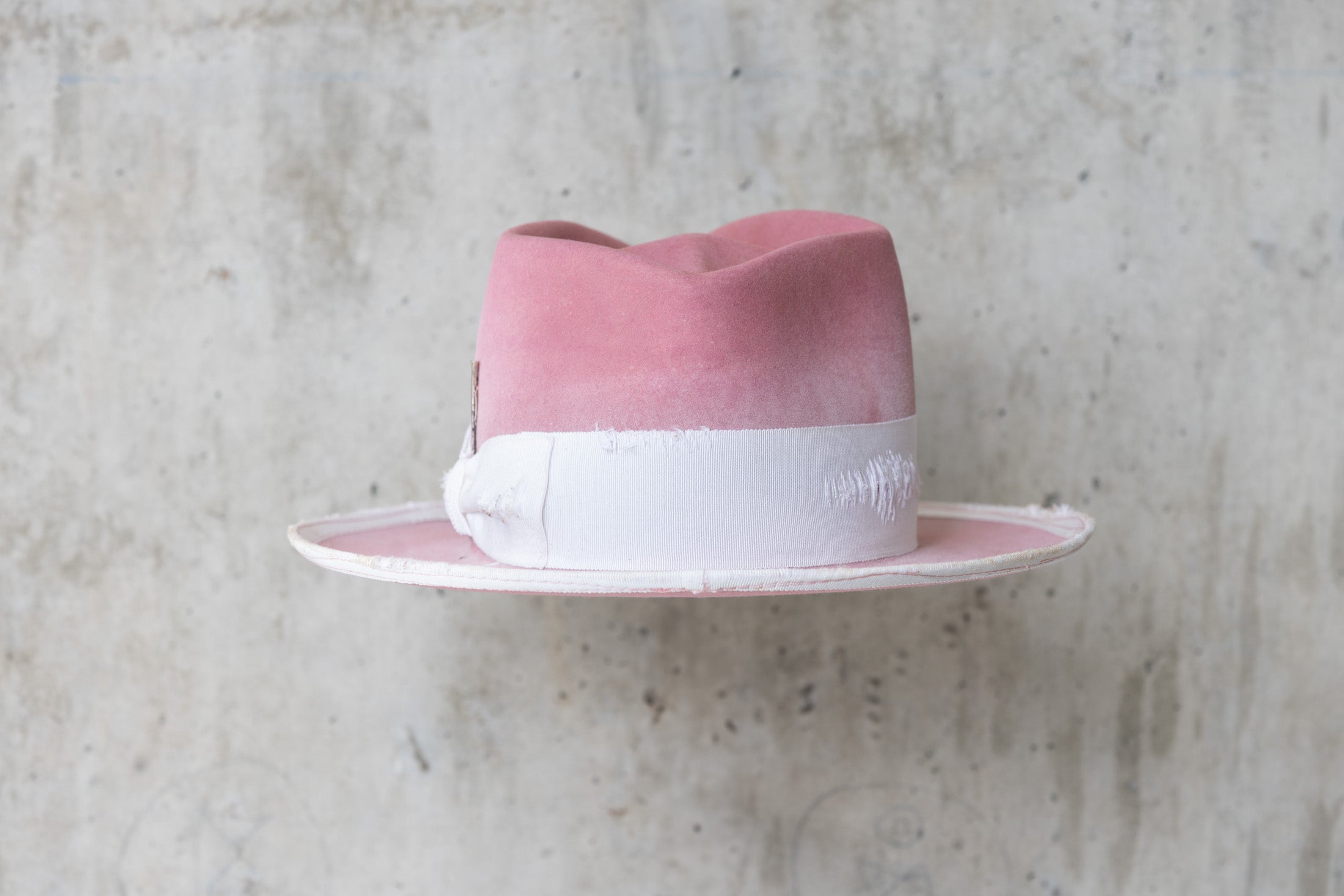 dusty pink rabbit beaver felt distressed hat with a fedora diamond crown and curled brim for men and women back
