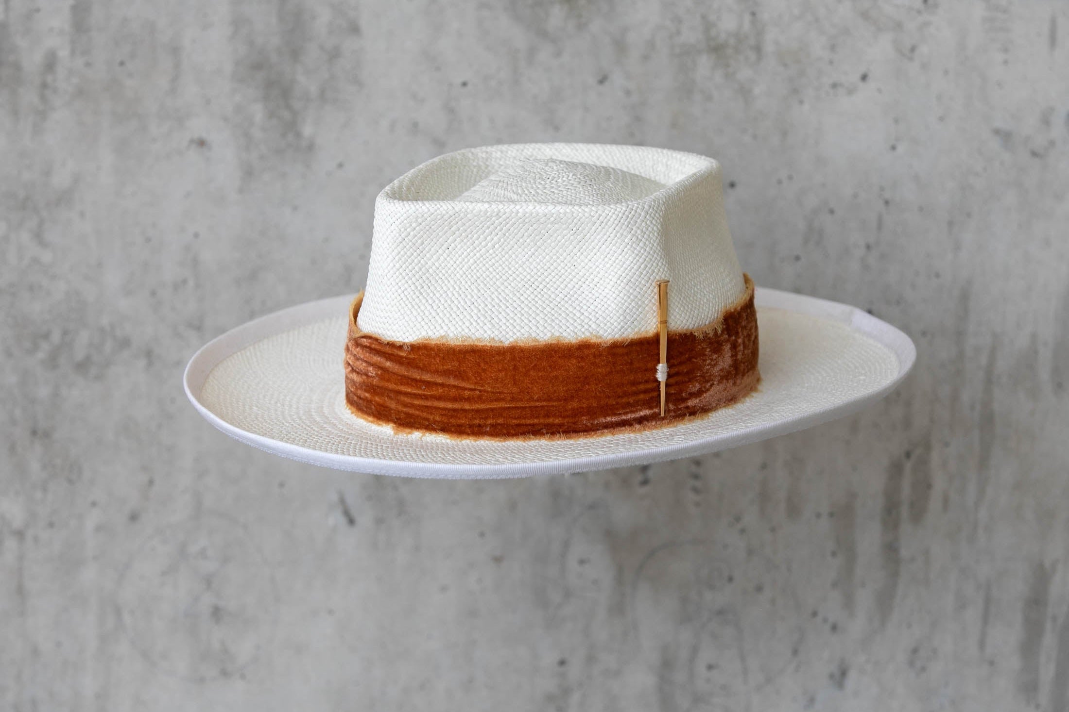 white Panama straw hat for wearing on a beach vacation for men and women left angle