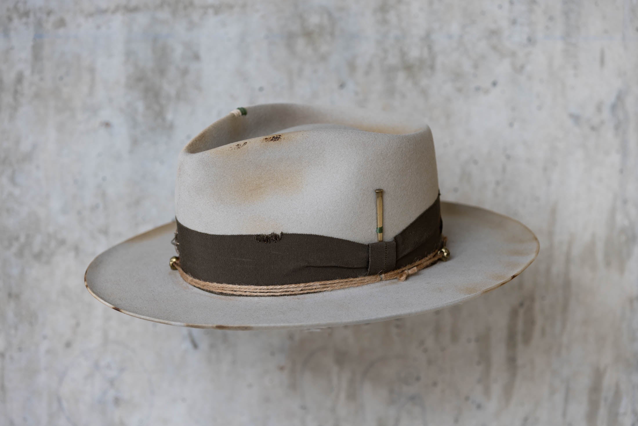 Silverbelly distressed beaver felt hat with teardrop crown and green band angle view
