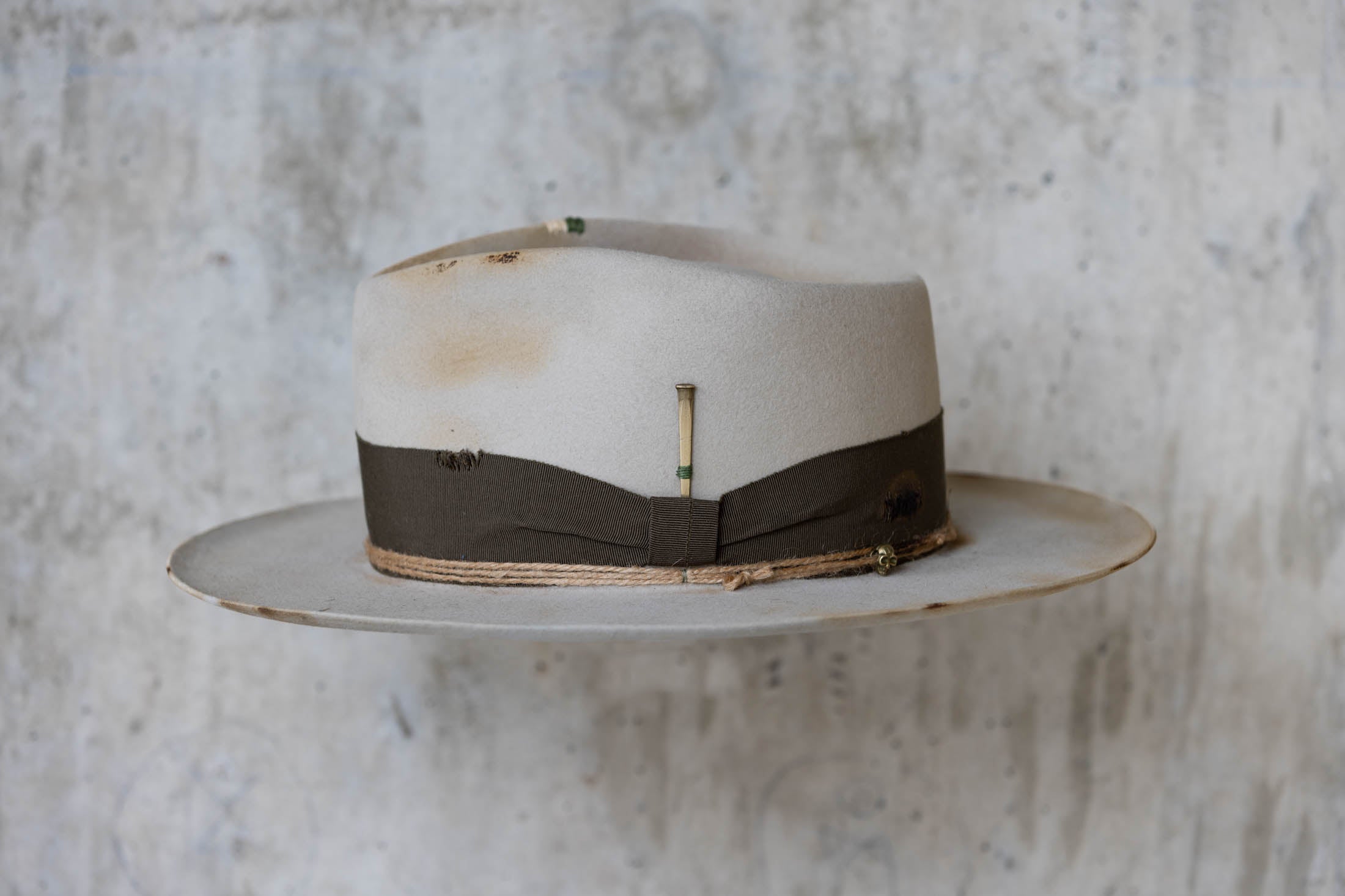 Silverbelly distressed beaver felt hat with teardrop crown and green band left side