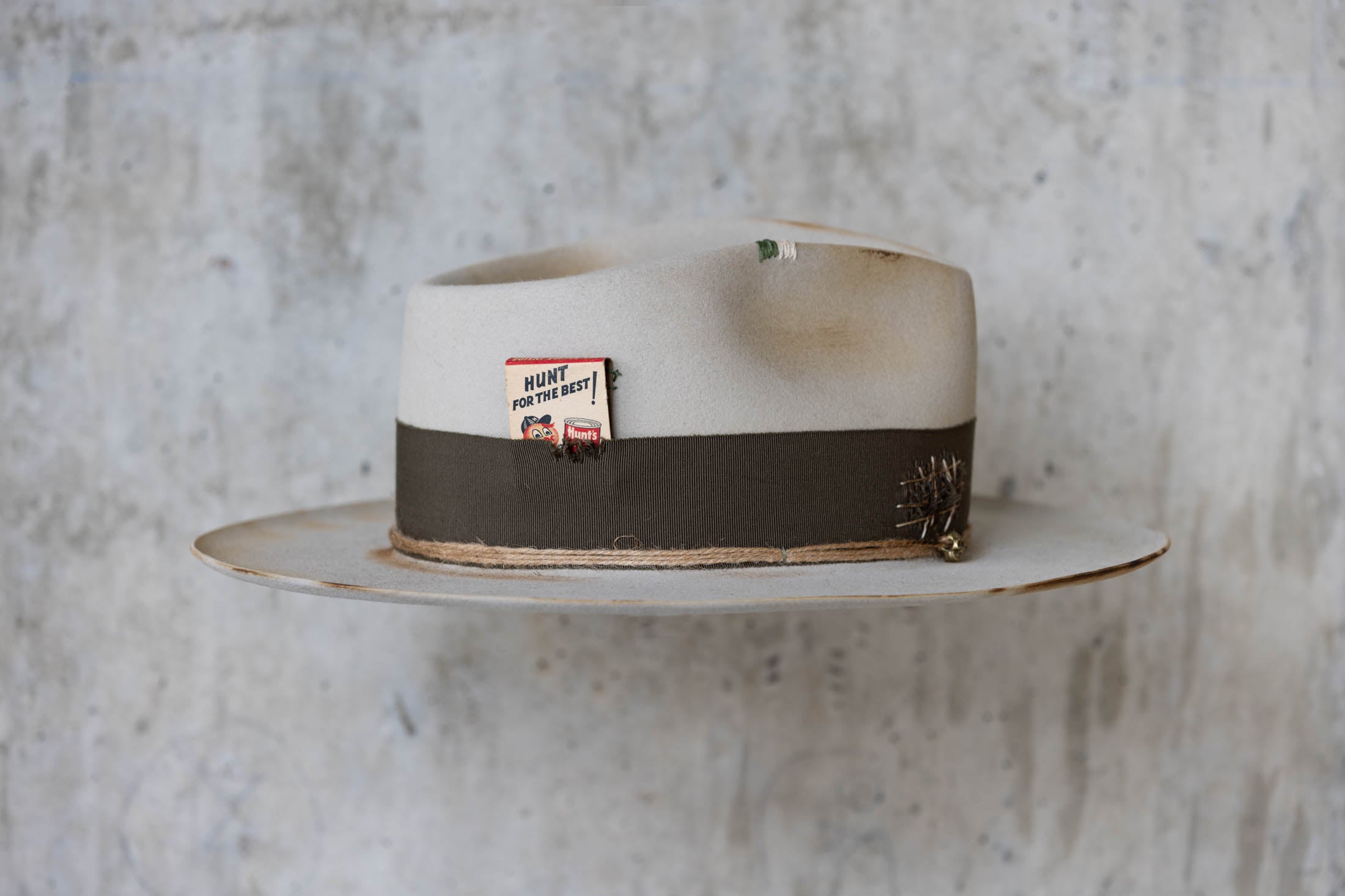 Silverbelly distressed beaver felt hat with teardrop crown and green band right side