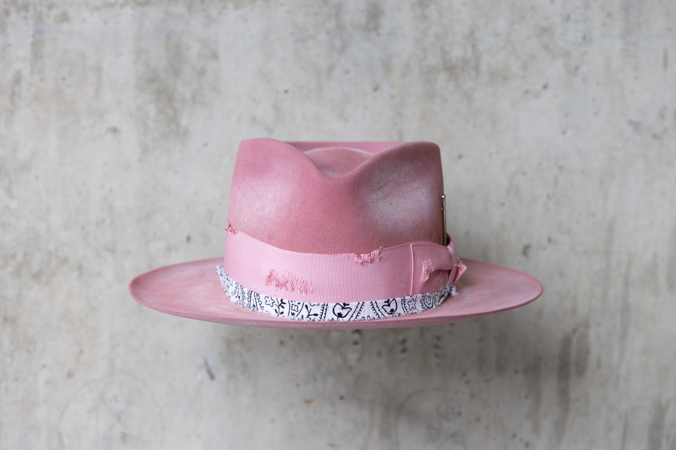 pink rabbit beaver felt distressed hat with a fedora teardrop crown and flat brim for men and women front