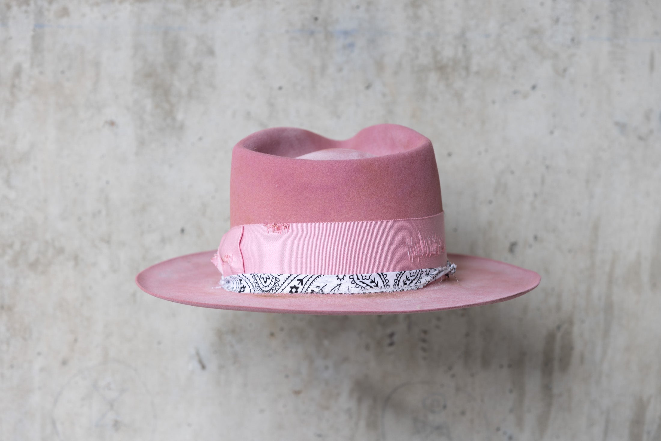 pink rabbit beaver felt distressed hat with a fedora teardrop crown and flat brim for men and women back