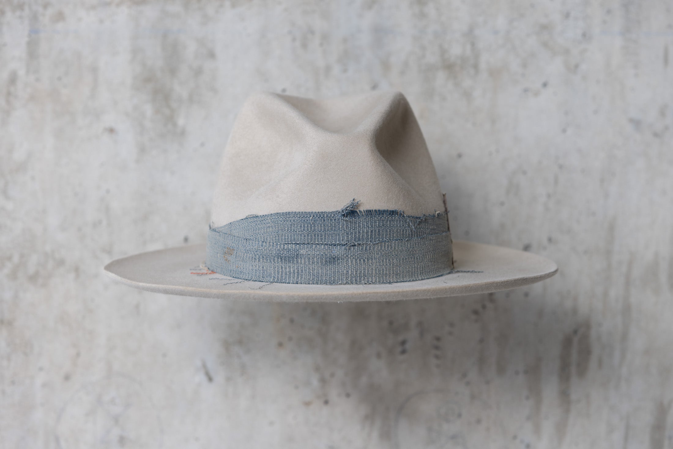 A custom beige wide brimmed beaver felt western fedora cowboy hat for men and women front