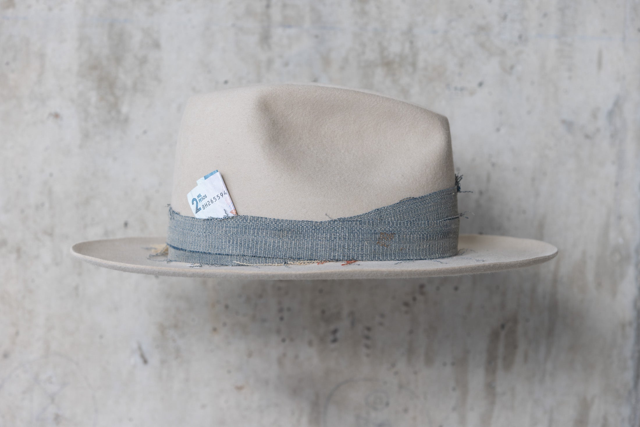 A custom beige wide brimmed beaver felt western fedora cowboy hat for men and women right