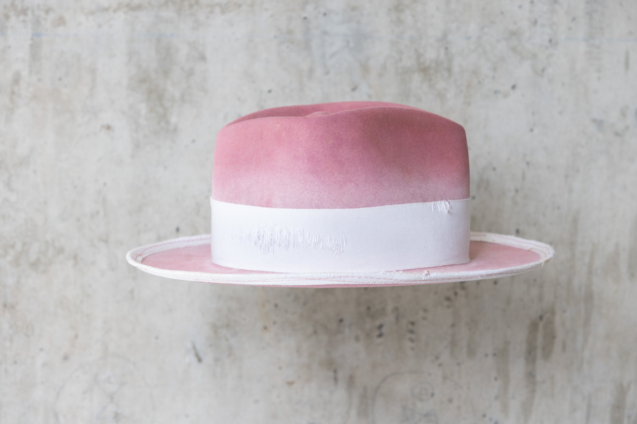 dusty pink rabbit beaver felt distressed hat with a fedora diamond crown and curled brim for men and women right