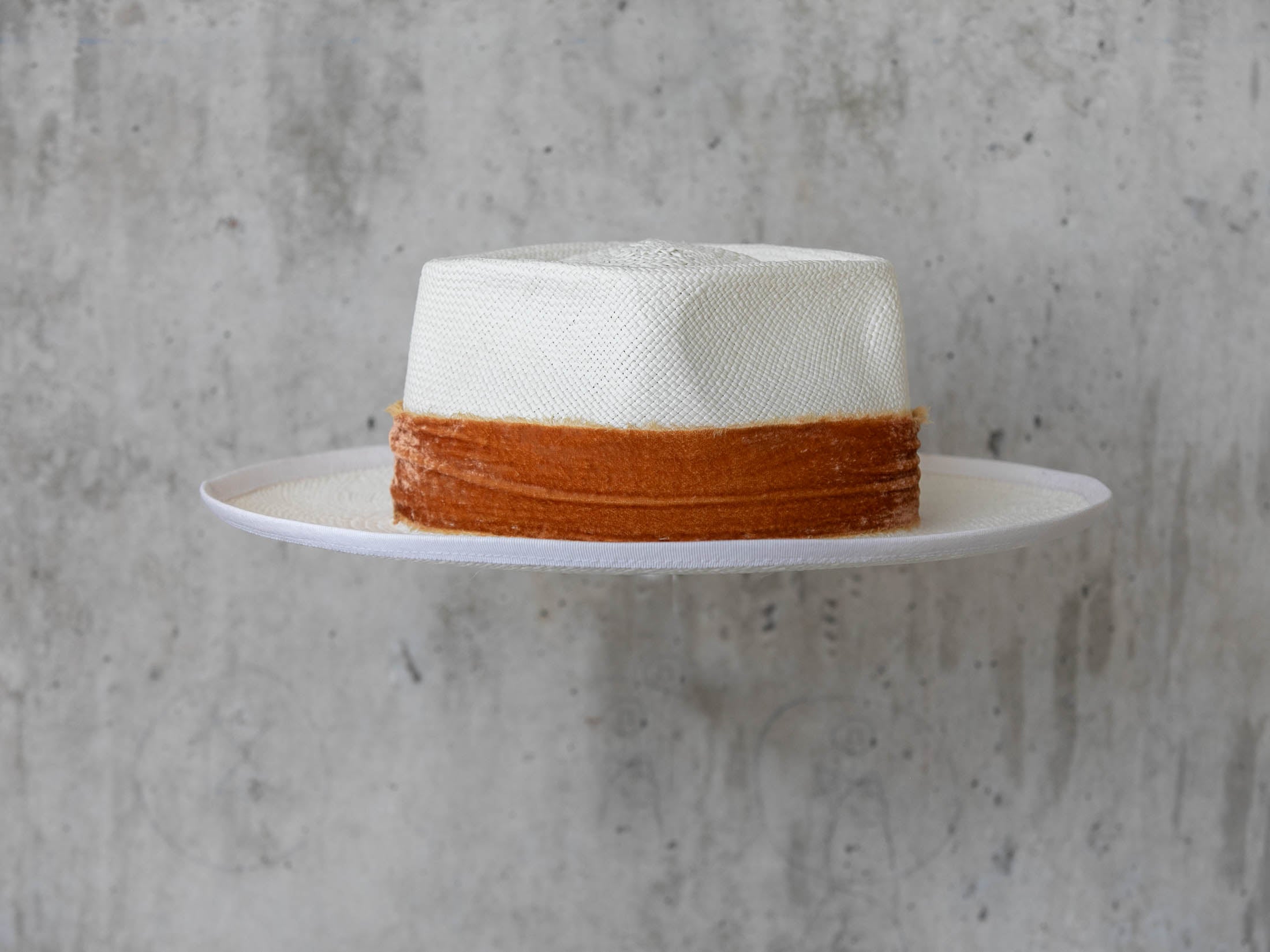white Panama straw hat for wearing on a beach vacation for men and women back